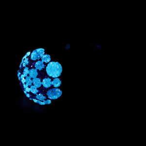 Ring with fluerescent diamonds